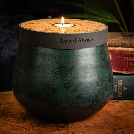 Green urn for cremation ashes made in the UK. Hand-made modern urn.